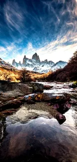 Stunning mountain landscape with vivid sky and serene river reflection.