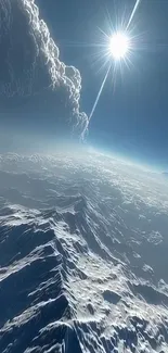 A stunning mountain landscape under a vibrant blue sky with clouds.