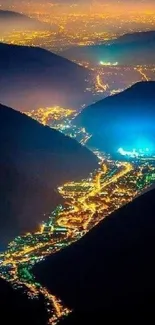 Breathtaking night view of a glowing cityscape in a mountain valley.