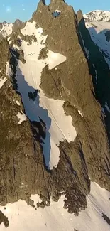 Majestic mountain peak with snow and a clear sky