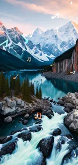 Breathtaking view of snowy mountains, flowing river, and cascading waterfalls at sunset.