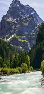 Majestic mountain with river and forest in the foreground.