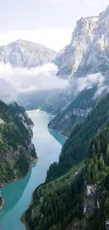 A stunning mountain river with lush forests and towering peaks under a cloudy sky.