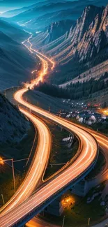 A stunning nighttime view of an illuminated winding mountain road.