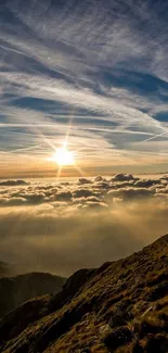 Sunset over mountains with clouds and blue sky.