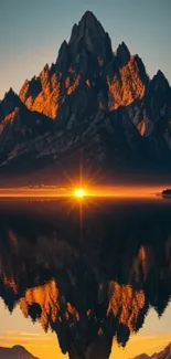 Majestic mountain with a glowing sunset reflected in water.
