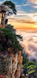 Mountain cliff at sunset with vibrant sky and lush greenery.