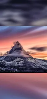 Vivid sunset over a majestic mountain peak, creating a dramatic nature scene.