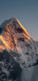 Stunning sunset over a snow-capped mountain peak.