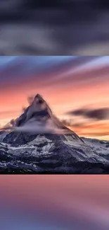 Majestic mountain at sunset with colorful sky.