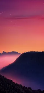 Vibrant sunset over mountains with a starry sky.