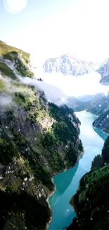 Breathtaking mountain valley with river and lush greenery.