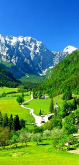 Mountain landscape with green valleys and snow-capped peaks.