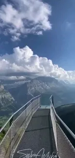 Mountain pathway under a vibrant blue sky with clouds.