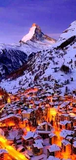 Snowy mountain village at night with streetlights glowing warmly.