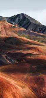 Multicolored mountain landscape with vibrant earthy tones.