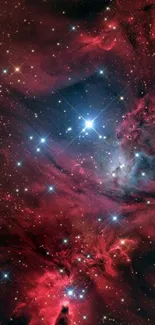 Vibrant red nebula with bright stars in deep space.