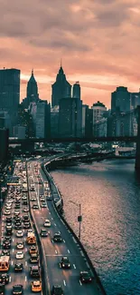 New York skyline at sunset with vibrant colors and city lights.