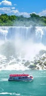 Niagara Falls with boat under a clear blue sky.