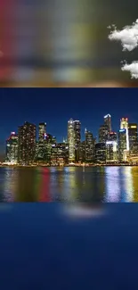 Night skyline with reflections and clouds.