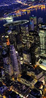 Aerial night view of a vibrant cityscape with illuminated skyscrapers and lively streets.