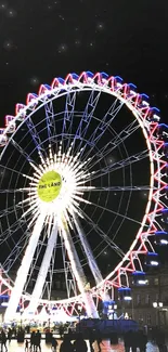 Illuminated Ferris wheel at night under dark sky.