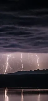 Breathtaking lightning striking over dark landscape, captured in a mobile wallpaper.