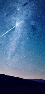 Shooting star over a star-filled night sky wallpaper.