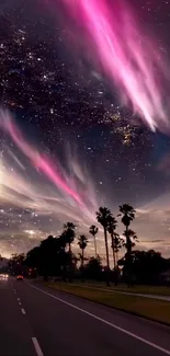 Vibrant night sky with pink aurora and stars over palm trees.