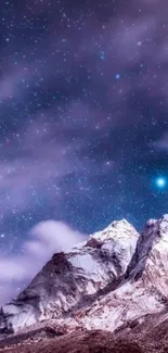 Ethereal starry night sky over snowy mountains wallpaper.