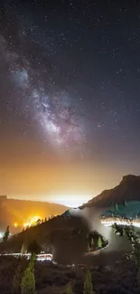 Starry night sky over mountain landscape with Milky Way.