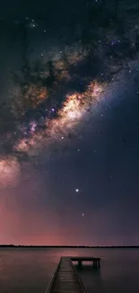 Night sky wallpaper showcasing the Milky Way over a calm lake, with a wooden pier.