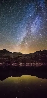 Stunning night sky with stars over mountains and lake, perfect for mobile wallpaper.