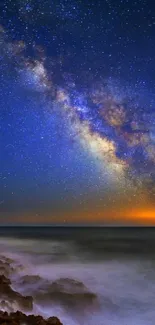 Starry night sky with Milky Way over ocean.