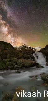 Waterfall under a star-filled sky with a mesmerizing galactic view.