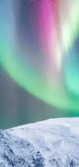 Northern Lights over snowy mountain with vibrant colors in night sky