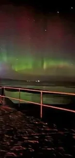 Peaceful pier under aurora-lit sky.