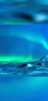 Vibrant Northern Lights over snowy mountains in a starry blue night sky wallpaper.