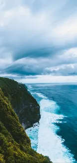 Breathtaking view of ocean cliff with lush greenery and vibrant blue sea.