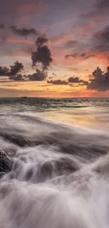 Vibrant sunset over ocean with dramatic waves and colorful sky.