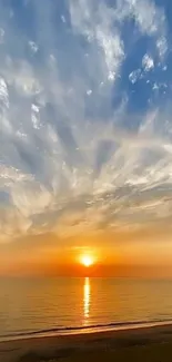 Vibrant ocean sunset with dramatic sky and reflective water.