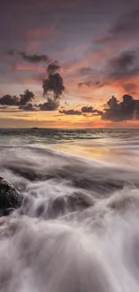 Stunning ocean sunset with waves and glowing sky.