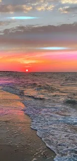 Beautiful ocean sunset with waves and vibrant sky colors.