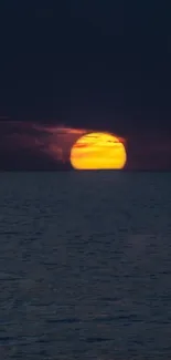 Beautiful sunset over a calm ocean horizon.