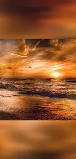 Stunning sunset over ocean waves with orange and gold hues.