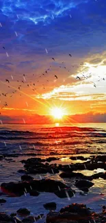 Ocean sunset with vibrant sky and birds flying over tranquil waters.