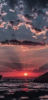 Gorgeous sunset over the ocean with dramatic clouds and colorful sky reflections.