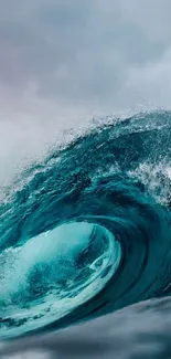 Dramatic ocean wave with blue hues crashing powerfully in a stormy sea.