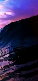 A stunning ocean wave with a sunset background for mobile wallpaper.