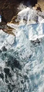 Aerial view of ocean waves crashing on rocky cliffs.